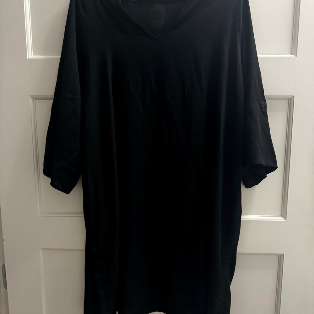 Elegant Black Long Sleeve Top or cover up . New with Tags